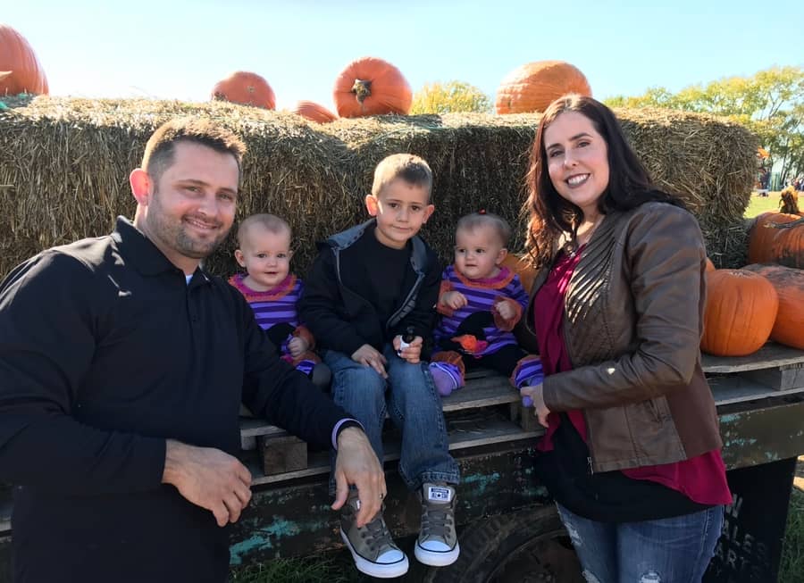 Daniel's family at a pumpkin patch in the fall
